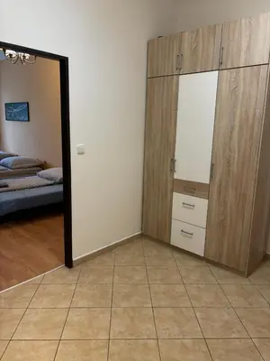 a room with a mirror and a closet and a bed at Apartmány Topolová 909B in Milovice