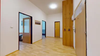 a hallway with four doors in a room at Apartmány Topolová 909B in Milovice