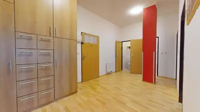 an empty room with lockers and a hallway with doors at Apartmány Topolová 909B in Milovice
