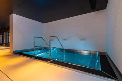 a hot tub in a room with at Hotel & Spa Chariclea in Poděbrady