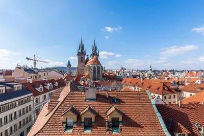 a view of a city with red roofs at Štupartská - Tyn Church View Residence with terrace in Prague