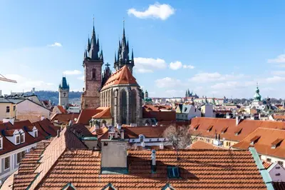a view of a city with roofs and churches at Štupartská - Tyn Church View Residence with terrace in Prague