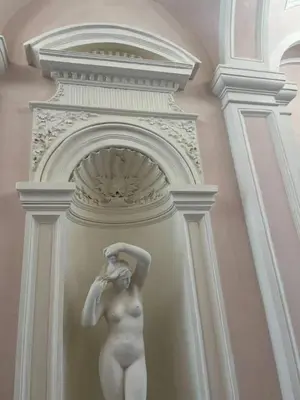 a statue of a woman on a wall at 2-Bed Apartment in Praha in Hřebečníky
