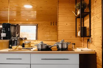 a kitchen with two pots on a stove top at Secret Lake Prag magic place relaxation& wellness in Řehenice
