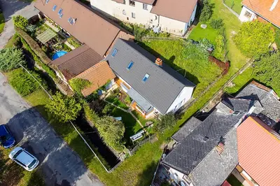 an overhead view of a house with a yard at Oplanská chalupa in Oplany