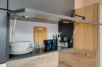 a kitchen with a counter with a bowl and dishes at Cosy apartment right after the National Museum in Prague