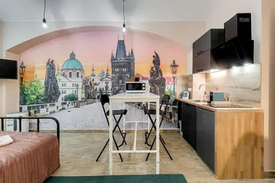 a kitchen with a mural of a city at Cosy apartment right after the National Museum in Prague
