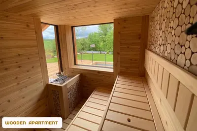 a inside view of a wooden cabin with a window at You and Me Apartments in Prosenická Lhota