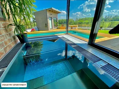 a swimming pool in the middle of a house at You and Me Apartments in Prosenická Lhota