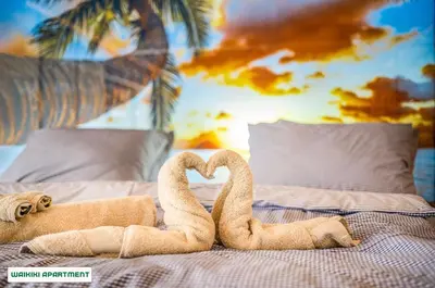two towel swans making a heart on a bed at You and Me Apartments in Prosenická Lhota