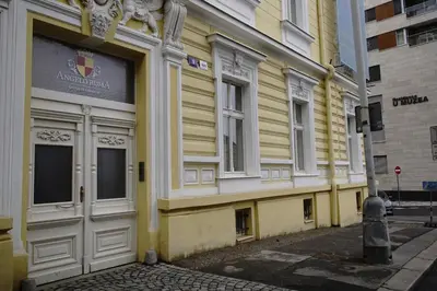 a yellow building on the side of a street at 420Welcome.Inn in Prague