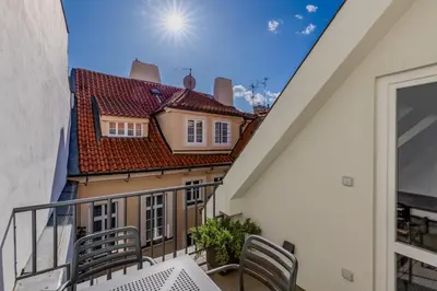 a balcony with a view of a house at Hotel Ikona in Prague