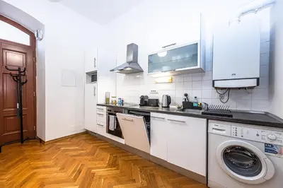 a bedroom with a large white bed with two pillows at Charles Apartments in Old Town in Prague
