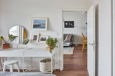 a bedroom with a white desk and a mirror at Prague Days - One-bedroom Apartment with Balcony and Garage Parking near the Vltava River in Holešovice in Prague