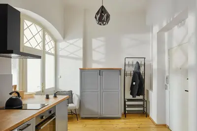 a kitchen with a white cabinet in a room at Prague Days - Old Town Square Apartments in Prague