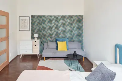 a living room with a couch and a table at Prague Days - Old Town Square Apartments in Prague