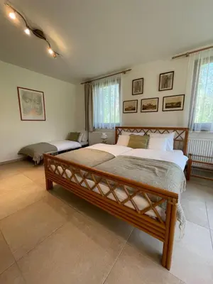a large bedroom with two beds in it at Kersko Apartments in Hradišťko