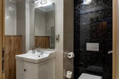 a bathroom with a sink and a mirror at Louren - The Bridge Inn in Prague