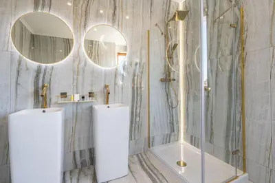 a bathroom with a tub and two mirrors at Serenity Luxusní vila s vířivkou a zahradou u Prahy in Prague