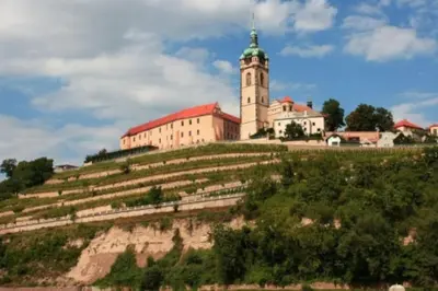 a large building on top of a hill at Apartmán Na Polabí in Mělník
