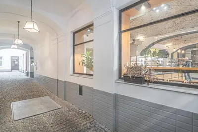 a corridor of a restaurant with a window at Útulny byt v centru Prahy in Prague