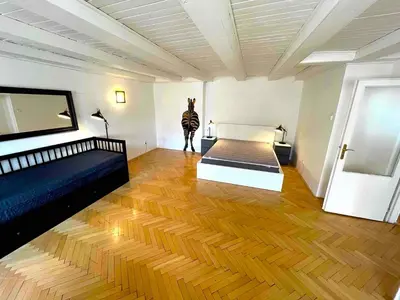 a room with a bed and a zebra statue in it at Kristian's Old Town Sq. Apartments in Prague