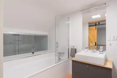 a garage with two cars parked in it at Prague Days - Loft with Garage and Workspace right next to Wenceslas Square in Prague