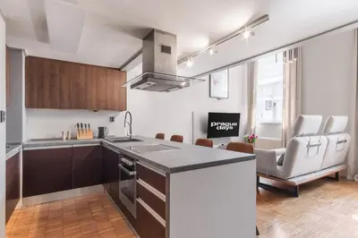 a kitchen with a large island in a room at Prague Days - Loft with Garage and Workspace right next to Wenceslas Square in Prague