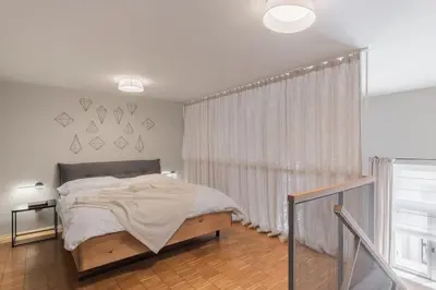 a living room with a couch and a tv at Prague Days - Loft with Garage and Workspace right next to Wenceslas Square in Prague