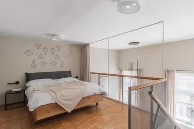 a white bathroom with a tub and a shower at Prague Days - Loft with Garage and Workspace right next to Wenceslas Square in Prague