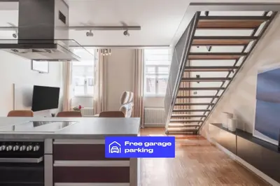 a pivot door in a kitchen with a bird cage at Prague Days - Loft with Garage and Workspace right next to Wenceslas Square in Prague