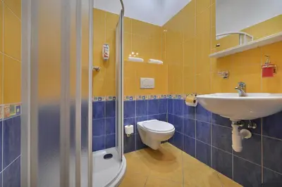 a bathroom with a toilet and a sink at Prague Season Three Stars in Prague