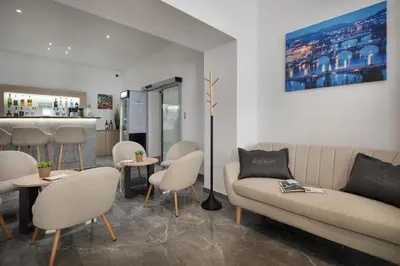 a living room with a couch and chairs and a bar at Prague Season Three Stars in Prague