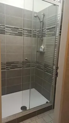 a shower with a glass door in a bathroom at Apartmán Poděbrady in Poděbrady