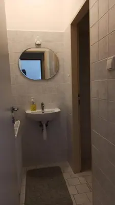 a bathroom with a sink and a mirror at Apartmán Poděbrady in Poděbrady