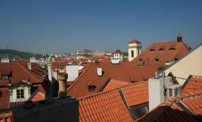 a view of roofs of a city with red roofs at Historic Centre Apartments I in Prague