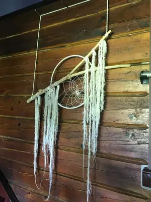 a dream catcher hanging on the wall of a cabin at Chata s duší in Beroun