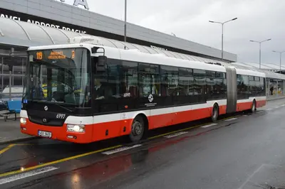 a bus is parked in front of a building at Airport Rooms in Prague