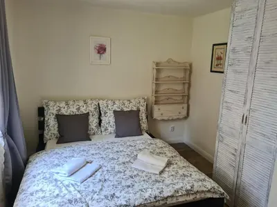 a bedroom with a bed with towels on it at Airport Rooms in Prague