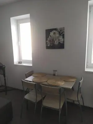 a white bathroom with a toilet and a window at Apartmán 10 in Županovice
