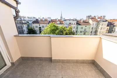 a balcony with a view of the city at Jiriho z Podebrad Apartments in Prague