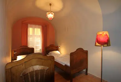 a bedroom with two beds and a lamp at 1 Bed Flat - Sleeps 3 - Pets - Wifi in Prague