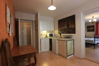 a kitchen with a table and a microwave at 1 Bed Flat - Sleeps 2 - Wifi in Prague