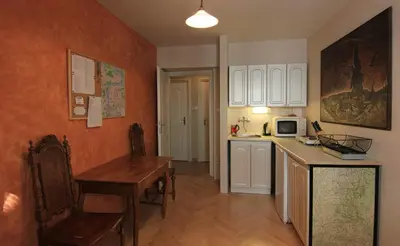 a kitchen with a table and a counter top at 1 Bed Flat - Sleeps 2 - Wifi in Prague