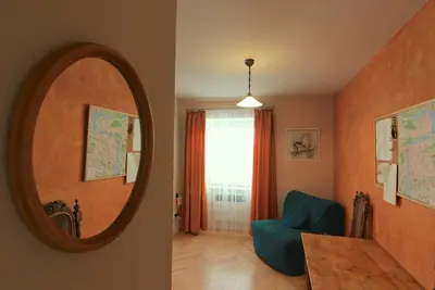 a room with a mirror and a table and a chair at 1 Bed Flat - Sleeps 2 - Wifi in Prague