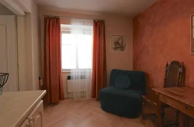a living room with a chair and a window at 1 Bed Flat - Sleeps 2 - Wifi in Prague