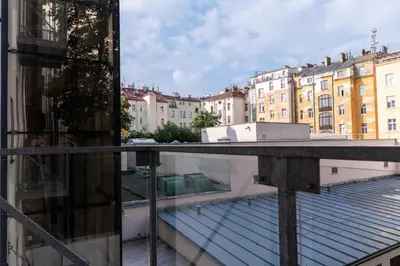 a view of a city from the balcony of a building at Designed apartment next to Vaclav square with terrace and private garage in Prague