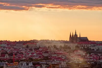 a view of a city at sunset at Luma Terra Prague Hostel in Prague
