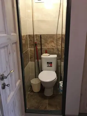 a small bathroom with a toilet in a shower at APARTMEN PRAHA in Prague