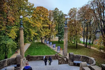 a group of people walking through a park at Riverside Apartment in Prague